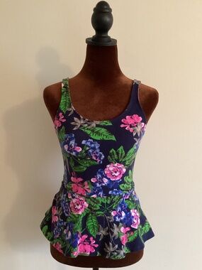 Express floral peplum scoop back zip up top